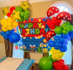 a birthday party with balloons and decorations