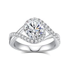 a white gold ring with diamonds on the band and a center stone in the middle