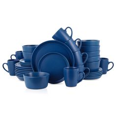 a blue dinnerware set with cups and saucers on the side, in front of a white background