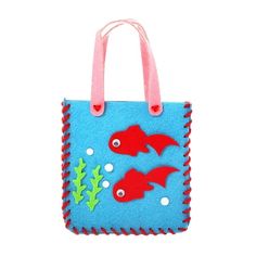 a blue felt bag with red fish on it