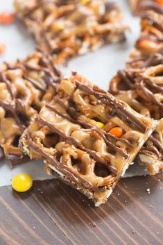 chocolate candy pretzels are stacked on top of each other with candy in the middle