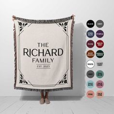 a woman is holding up a blanket with the words, the richard family on it