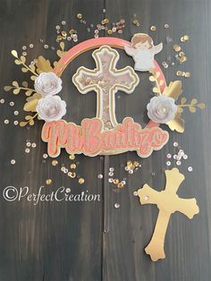 a wooden table topped with a cake topper and some confetti on it