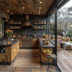 an outdoor kitchen with wooden floors and walls