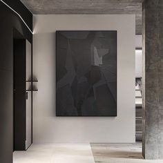 an abstract painting hangs on the wall next to a doorway in a room with white walls