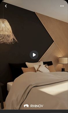 a bed room with a neatly made bed and pillows