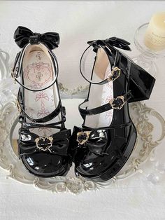 Step into a world of whimsical elegance with these enchanting platform heels, perfectly blending the allure of lolita and kawaii fashion. These shoes feature a sturdy chunky high heel, offering both height and comfort for all-day wear. The upper is adorned with charming rose heart embellishments, adding a touch of romantic flair, while the back of the heel is graced with a delicate bow, enhancing the overall cuteness. The crisscross design across the shoe adds a dynamic element, providing both style and structure. Completing the look, the buckle strap is also crafted with a rose heart design, ensuring that every detail of these shoes captures the essence of playful sophistication.  Please note that the price includes one pair of shoes.   	 		 			Size 			34 			35 			36 			37 			38 			39 Kodona Fashion, Heart Embellishments, High Block Heels, Steampunk Fashion Male, Rose Heart, Steampunk Accessories, Chunky High Heels