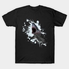 a black t - shirt with a shark's mouth and paint splatters on it