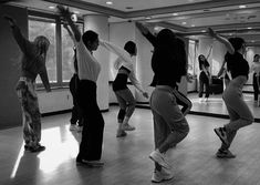 a group of young people dancing in a dance studio