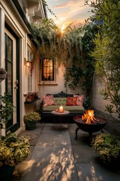 Cozy patio with plants, a cushioned bench, and a fire pit at sunset. Outdoor Small Yard Ideas, Small Patio Area, Small Cozy Garden, Small Cozy Patio Ideas, Small Apartment Backyard Ideas, Outdoor Patio Table Decor, Closed Patio Ideas, Small Outdoor Patio Ideas Desert, Small Outdoor Sitting Area