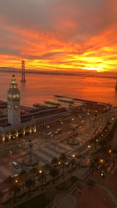 an aerial view of a city at sunset