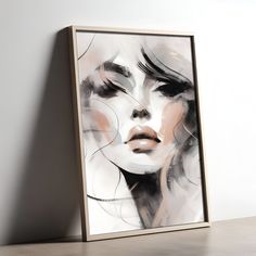 a painting on the wall with a woman's face