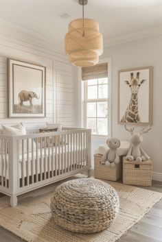 a baby's room with white walls and wooden floors