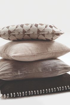 three pillows stacked on top of each other