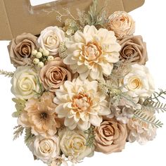 a bouquet of flowers sitting in front of a cardboard box