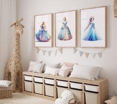 a room filled with furniture and pictures on the wall next to a giraffe