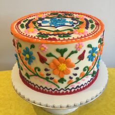 a decorated cake sitting on top of a table