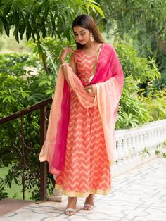 Set of 2 consists of kalidaar and dupatta. Painting you in the colors of the festive season with this shaded peach lehriya kalidaar Kurta: A stunning hand-printed lehriya kalidaar is mesmerizing shades of peach & red with delicate gota detailing Dupatta: A peach ombre shaded dupatta with gota lappa work Fit: Fitted at bust. Flared up to ankle Wash Care Instructions: Dry Clean Only Note: Bottom not included Available in other colors The product will be shipped within 15-20 days of the order p Orange Sharara With Straight Kurta And Pallu, Designer Chanderi Salwar Kameez In Peach, Peach Anarkali Salwar Kameez In Chanderi, Peach Anarkali Chanderi Kurta, Festive Peach Kurta With Zari Work, Pink Dola Silk Kurta With Cutdana, Traditional Semi-stitched Peach Salwar Kameez, Designer Peach Salwar Kameez For Diwali, Pink Dola Silk Kurta For Navratri