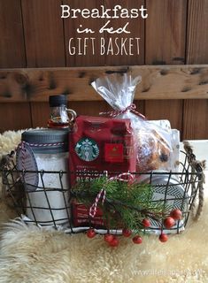 a basket filled with coffee, cookies and other items on top of a fur rug