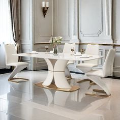 an elegant dining room with white walls and flooring