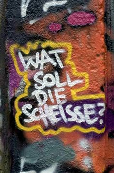 graffiti on the side of a building with words that say, what soil die cheese?