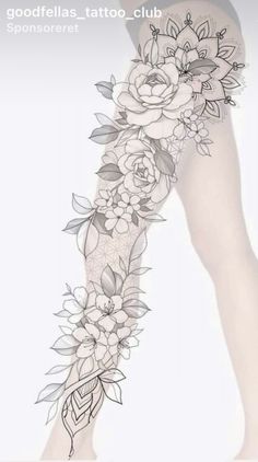 a woman's leg with flowers and leaves on it