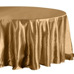 a round table with gold cloth on it