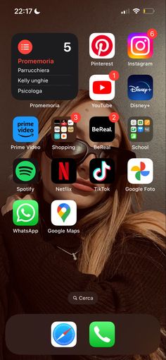 an image of a woman with many different app icons on her face and in the background