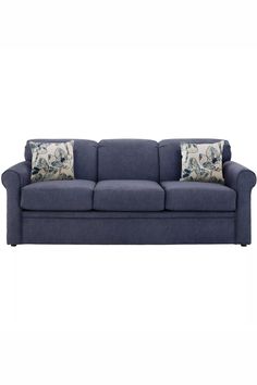 a blue couch with two pillows on it's back and one pillow in the middle