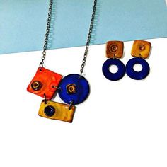 Save 20% on your order when you subscribe- https://www.mailchi.mp/b4b63543aa8d/sassysachaModern Geometric Jewelry, Quirky Statement Necklace with Matching Oversized EarringsThis modern geometric jewelry set was handmade from polymer clay and hand painted with alcohol ink. It features a mix of shapes and vibrant colors. It is bold and chunky yet lightweight and comfortable to wear. From this listing you can purchase pieces individually or combine to save.Measurements of pieces:The necklace  measu Modern Geometric Jewelry, Turquoise Statement Earrings, Geometric Pendant Necklace, Drop Hoop Earrings, Oversized Earrings, Painted Earrings, Geometric Pendant, Geometric Jewelry, Jewelry Outfit