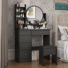 a bedroom with a vanity, mirror and stool next to a bed in front of a painting on the wall