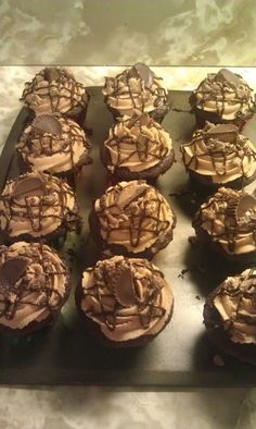 chocolate cupcakes with peanut butter frosting and drizzled on top