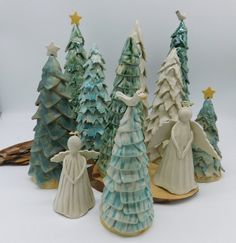 small ceramic christmas trees with angel figurines