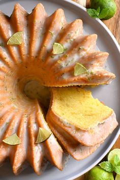 a bundt cake with limes on the side