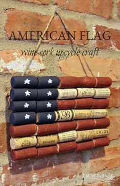 an american flag made out of wine corks hanging on a brick wall with the words,