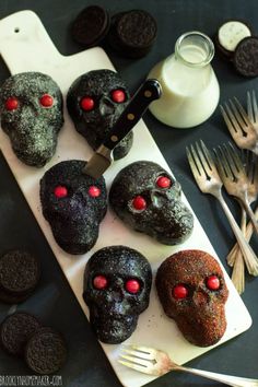 some cookies with red eyes are on a plate