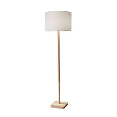 a floor lamp with a white shade on the base and a square light in front of it