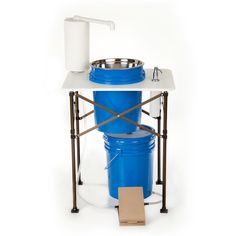 a large blue barrel with a sink on it's side and a cart attached to it