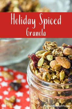 a jar filled with granola sitting on top of a red and white table cloth