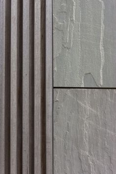 the corner of a building with some concrete on it