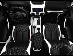 the interior of a car with black and white leather