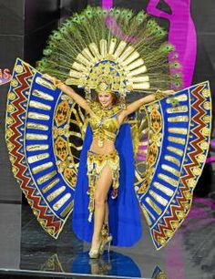 a woman dressed in an elaborate costume on stage