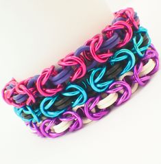 multicolored bracelets are stacked on top of each other