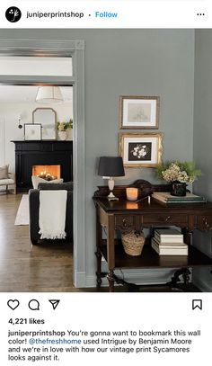 a living room filled with furniture and a fire place in the fireplace behind it's door