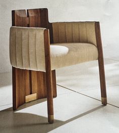 a wooden chair sitting on top of a white floor