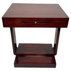 a small wooden table with one drawer open