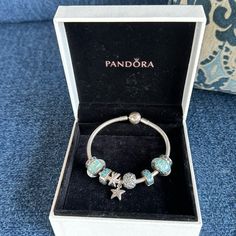 Pandora Beach Theme Bracelet, 7 Inches In Size Also Comes With Box And The 9 Charms. 2 Starfish Charms In The Center, Turquoise ,Blue And Silver Just Like New Pandora Bracelet Blue Theme, Pandora Summer Bracelet, Blue Pandora Bracelet, Pandora Beach, 2025 Wishlist, Pandora Bracelet Charms Ideas, Vision Bored, Jewelry Pandora, Bracelet Inspo