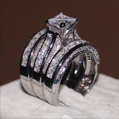 a wedding ring with two rows of diamonds on it