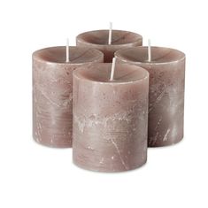 four candles are sitting next to each other