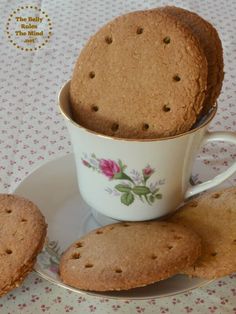 some cookies are in a cup on a plate